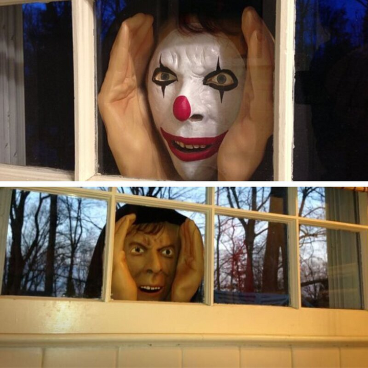 Halloweenin realistinen pelottava lateksinen ikkunasta kurkistava hahmo imukupilla