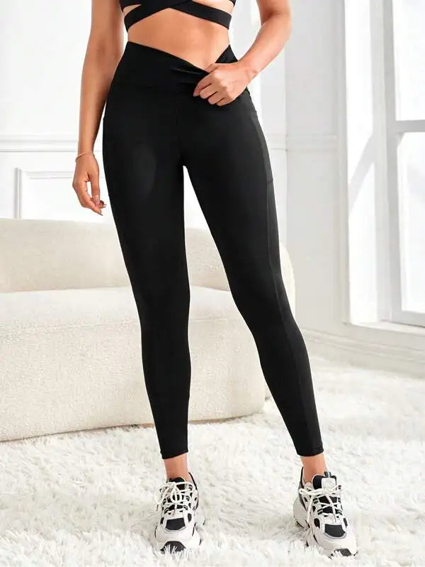 Enfärgade yogaleggings med hög midja och fickor för kvinnor