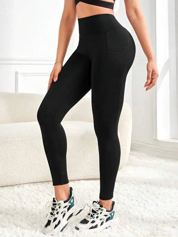 Enfärgade yogaleggings med hög midja och fickor för kvinnor